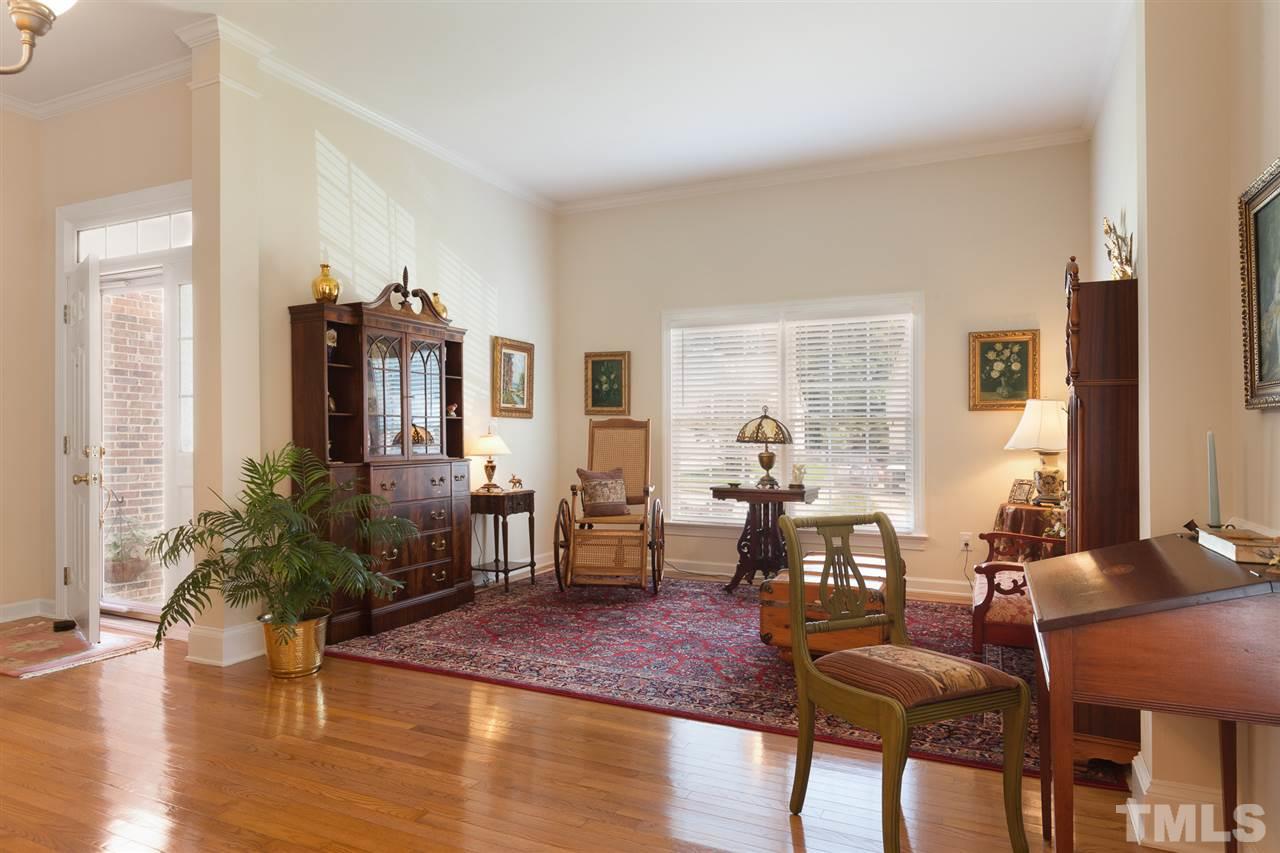 4008 Batiste Road Raleigh, NC 27613 - Photo 6 of 24 a living room with furniture dining table and wooden floor