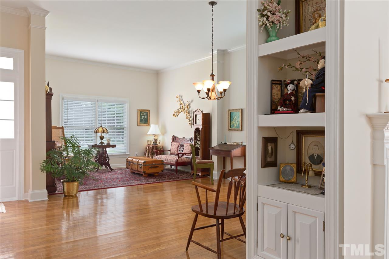 4008 Batiste Road Raleigh, NC 27613 - Photo 10 of 24 a living room with fireplace furniture and a potted plant