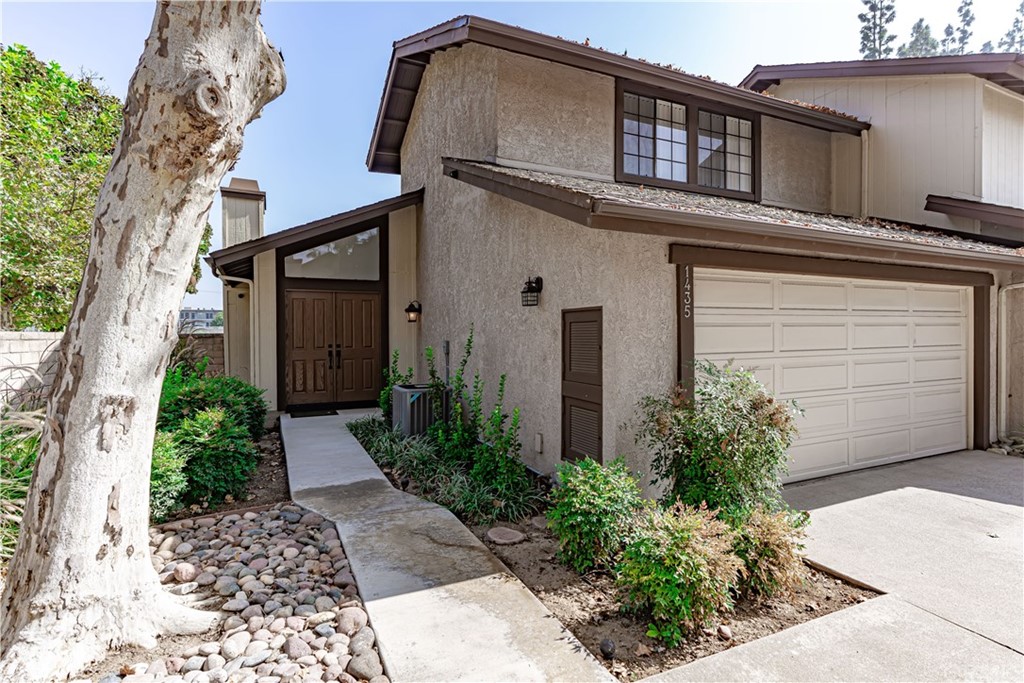 front view of a house with a small yard