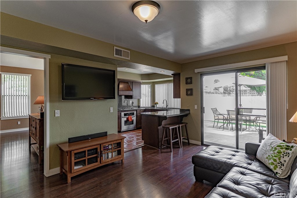 1435 Athena West Covina, CA 91790 - Photo 19 of 45 a living room with furniture a flat screen tv and wooden floor