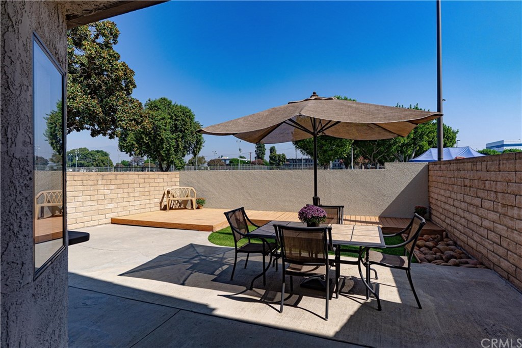 1435 Athena West Covina, CA 91790 - Photo 20 of 45 a view of table and chairs under an umbrella