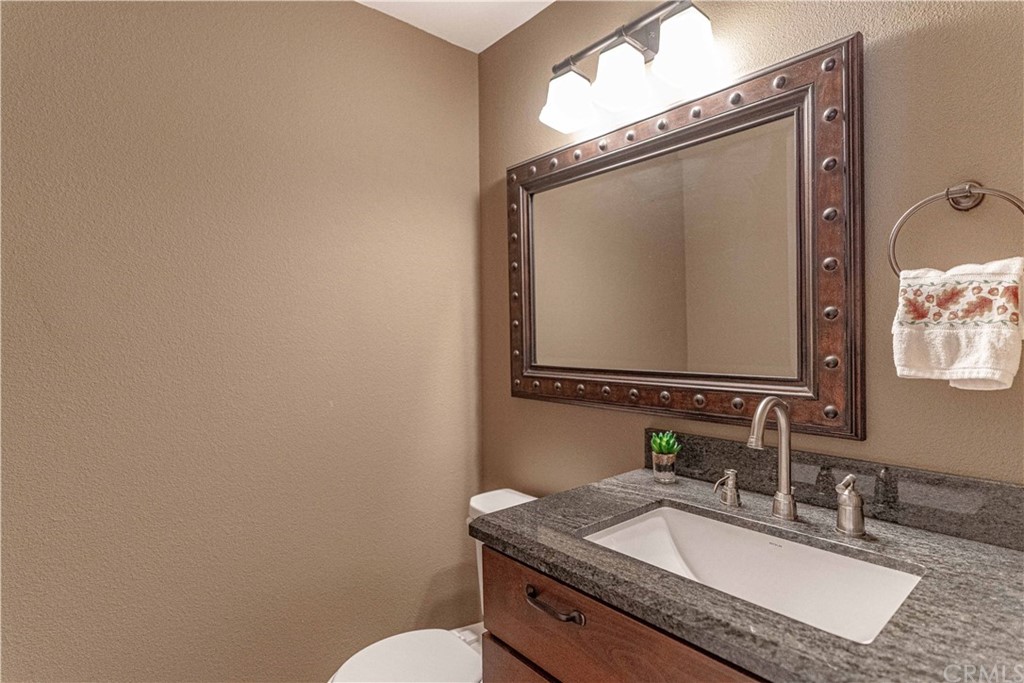 1435 Athena West Covina, CA 91790 - Photo 21 of 45 a bathroom with a granite countertop sink mirror vanity and toilet