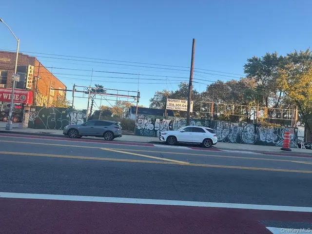 a view of a street with an outdoor space