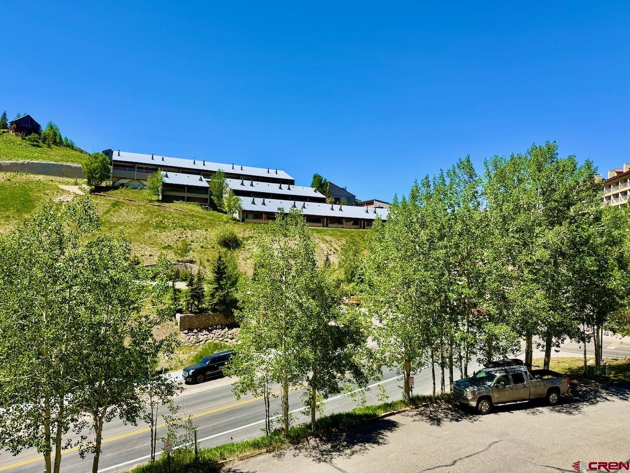 11 Snowmass Road, Unit 337 Crested Butte, CO 81225 - Photo 19 of 35 a view of a lake with outdoor space