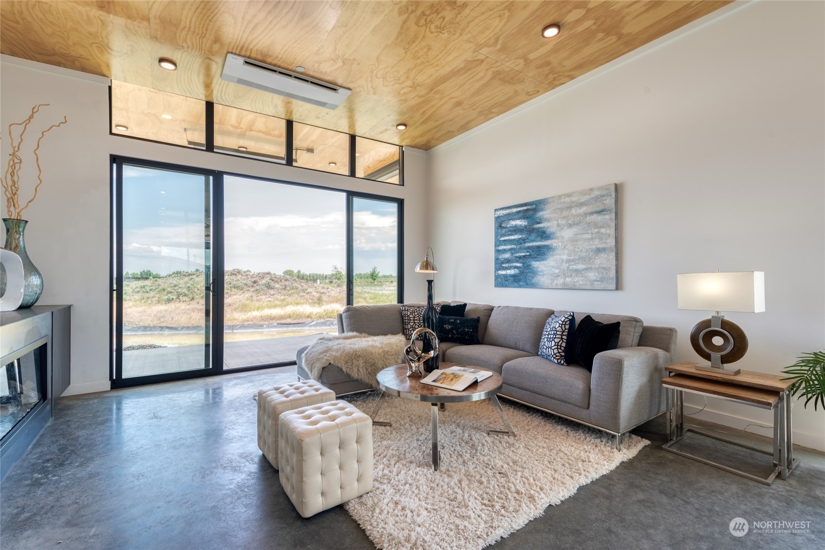 232 (lot 31) Nw Rattlesnake Point Road Quincy, WA 98848 - Photo 14 of 37 a living room with furniture and a floor to ceiling window