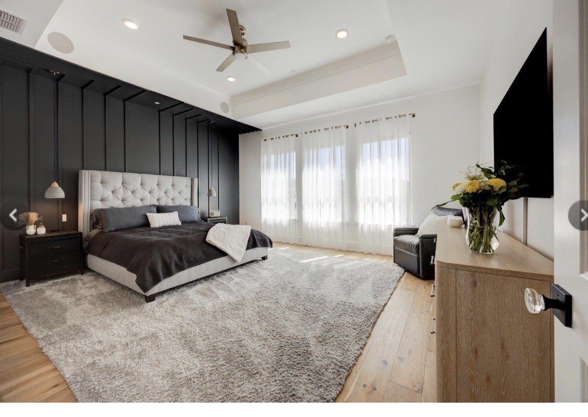 6817 Davenport Divide Road Austin, TX 78738 - Photo 12 of 28 a bedroom with a bed window and a flat screen television