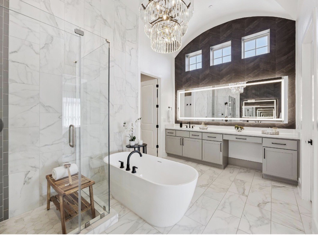 6817 Davenport Divide Road Austin, TX 78738 - Photo 13 of 28 a bathroom with a tub sink and mirror