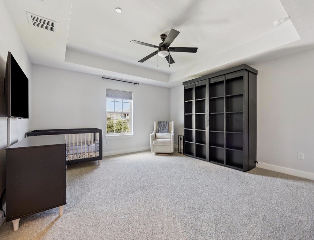 6817 Davenport Divide Road Austin, TX 78738 - Photo 24 of 28 a living room with furniture and a ceiling fan