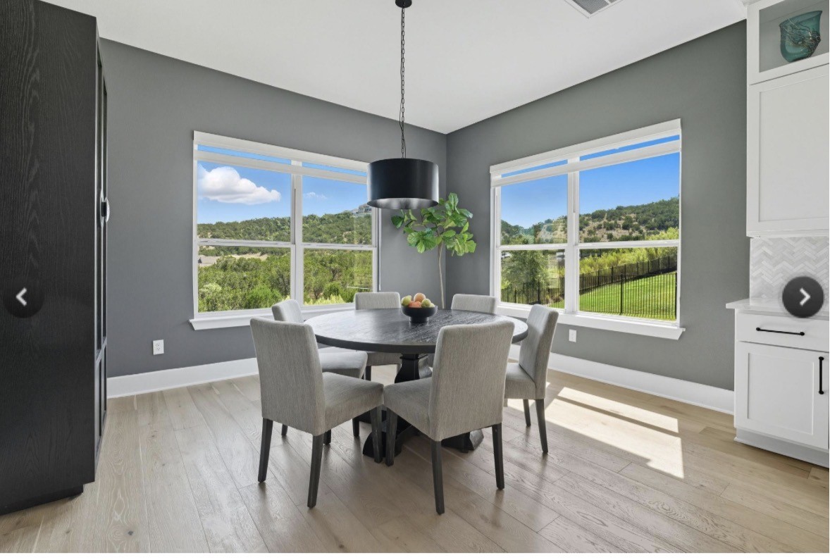 6817 Davenport Divide Road Austin, TX 78738 - Photo 5 of 28 a dining room with furniture window wooden floor