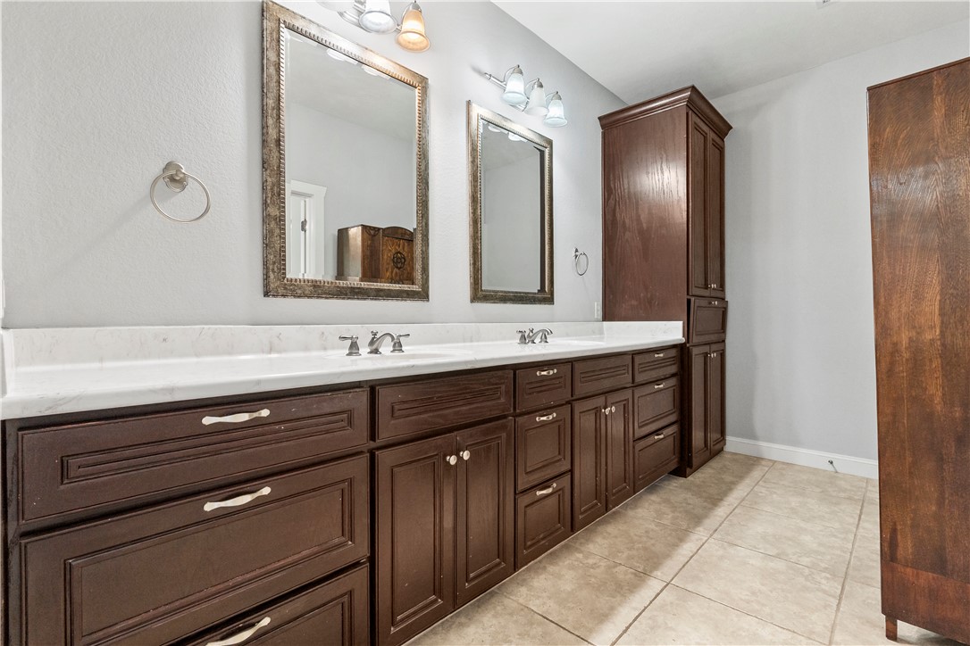 6701 Old Reliance Road Bryan, TX 77808 - Photo 19 of 44 a bathroom with a double vanity sink mirror and double