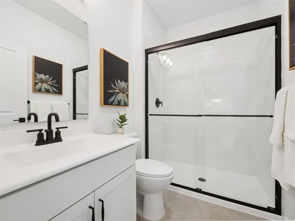 a large kitchen with stainless steel appliances kitchen island granite countertop a stove and a sink