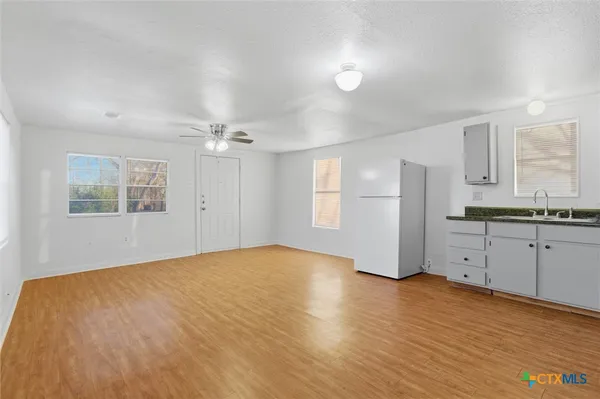 a view of a kitchen with marble kitchen and a sink