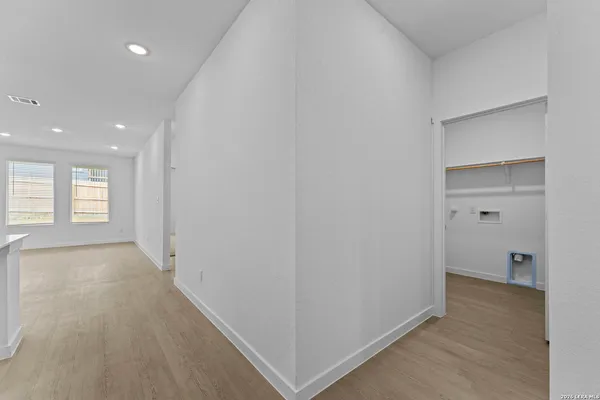 a large kitchen with stainless steel appliances kitchen island a large counter top and a stove top oven