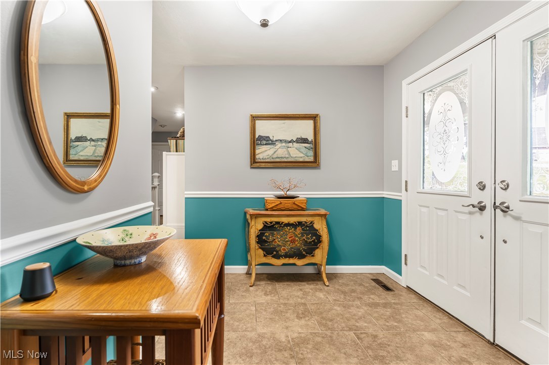 155 Ridgewood Boulevard Belpre, OH 45714 - Photo 10 of 49 Entryway featuring french doors and light tile patterned floors