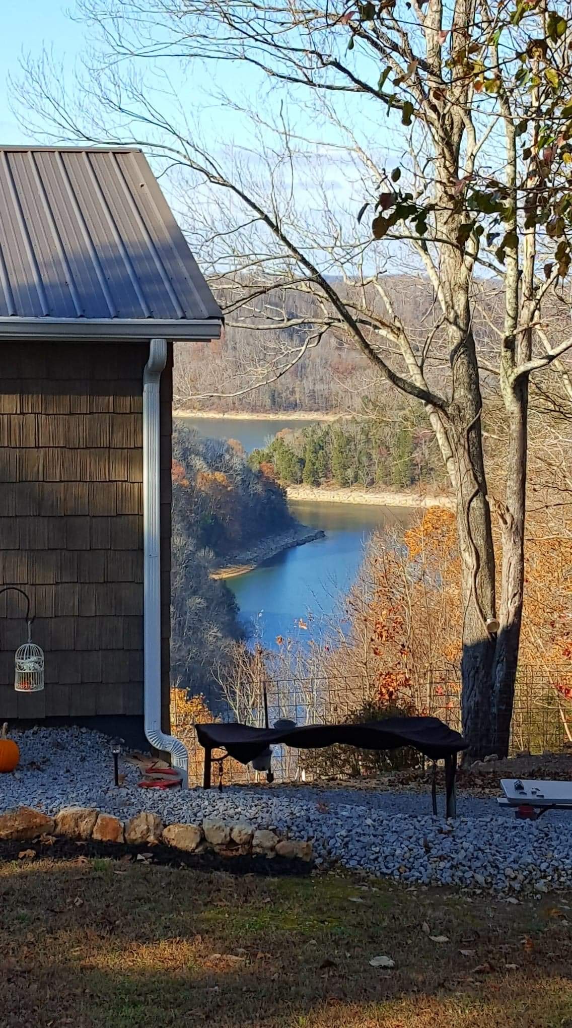 975 Rolling Acres Road Smithville, TN 37166 - Photo 9 of 26 a wooden bench sitting in front of a building