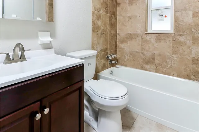 a bathroom with a sink toilet and bathtub