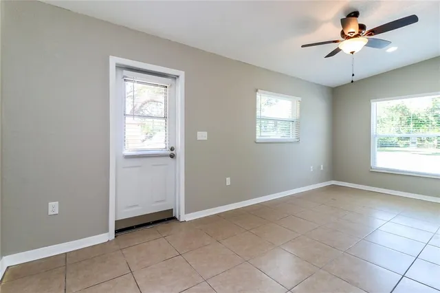 a view of an empty room with a window