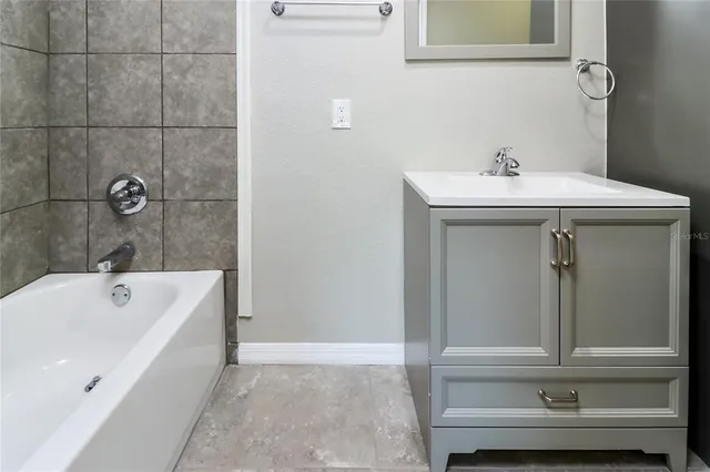 a bathroom with a sink and a bathtub