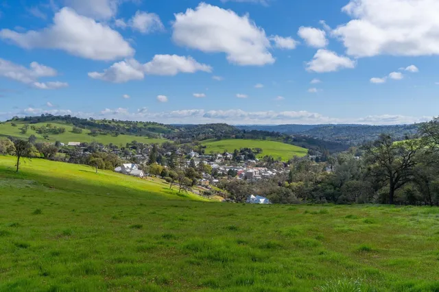a view of a golf course with green space