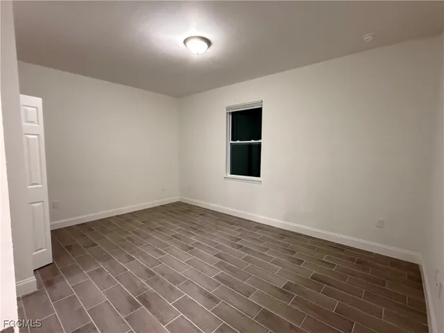 a view of kitchen with a sink and chandelier