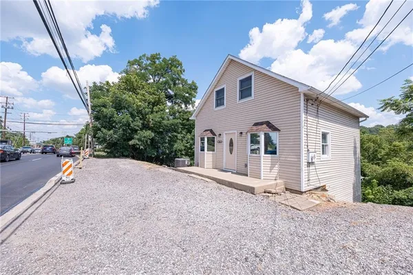 a view of a house with a street