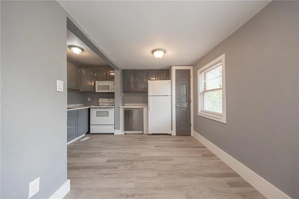 a kitchen with stainless steel appliances a refrigerator and a sink