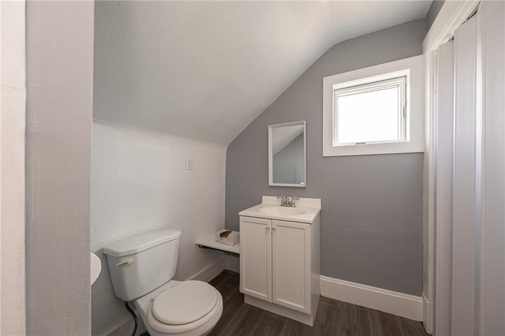 1214 Washington Pike Bridgeville, PA 15017 - Photo 17 of 39 a white toilet sitting next to a bathroom sink