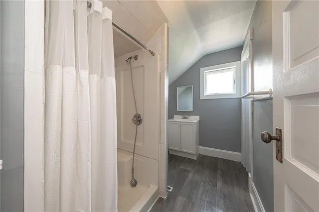 a view of a bathroom from a hallway