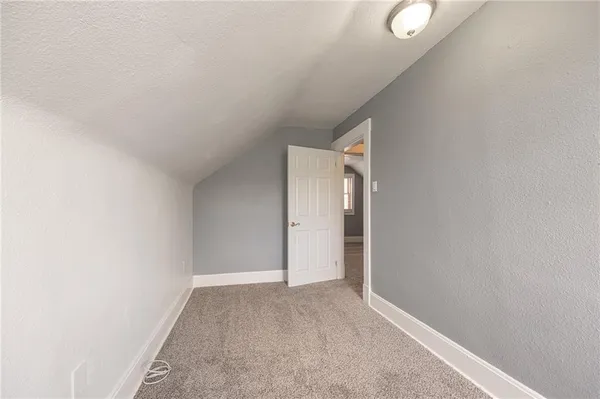 a view of hallway with closet
