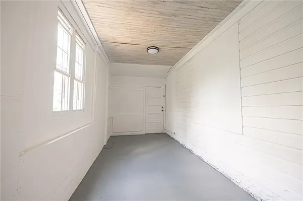 a view of empty room with windows