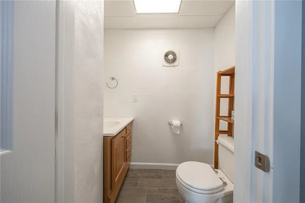 a bathroom with a toilet a sink and shower