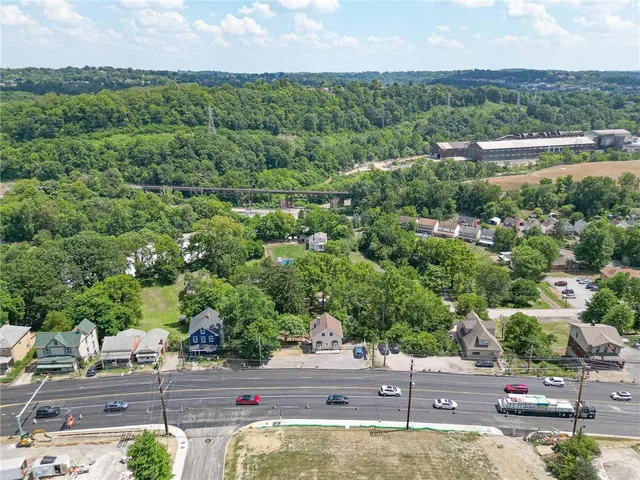 an aerial view of a houses with outdoor space