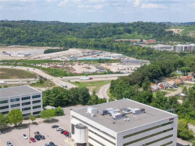 a view of a terrace with a garden and trees