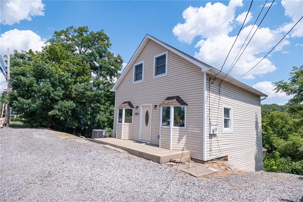 1214 Washington Pike Bridgeville, PA 15017 - Photo 5 of 39 a view of a house with a yard