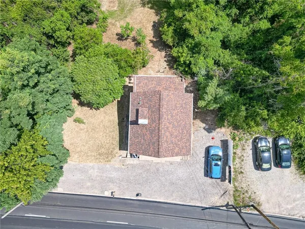 an aerial view of a house with outdoor space