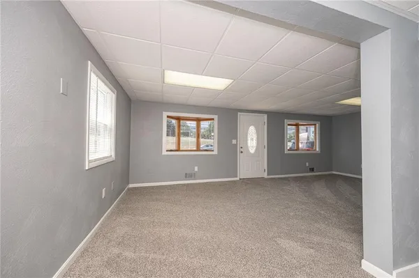 a view of an empty room with a window