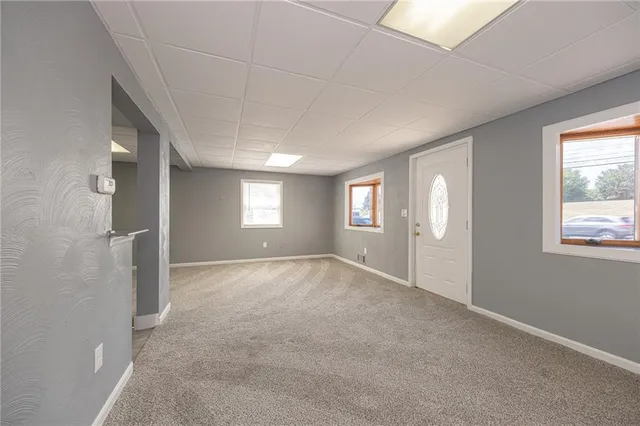 a view of empty room with windows