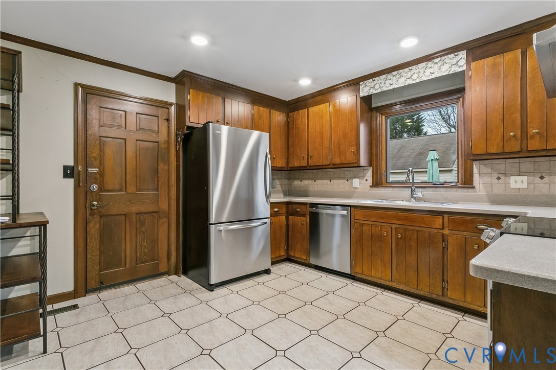 504 Meadowfield Road Yorktown, VA 23692 - Photo 15 of 45 a kitchen with stainless steel appliances granite countertop a refrigerator and a sink