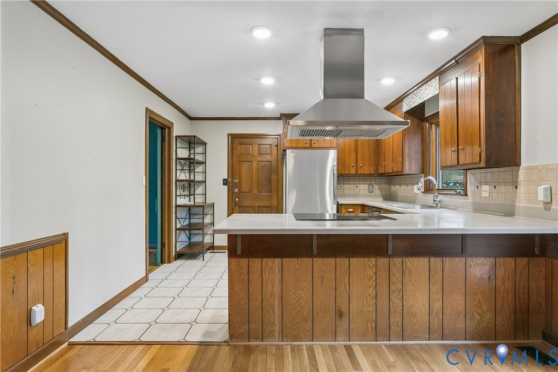 504 Meadowfield Road Yorktown, VA 23692 - Photo 17 of 45 a kitchen with stainless steel appliances kitchen island granite countertop a sink and cabinets