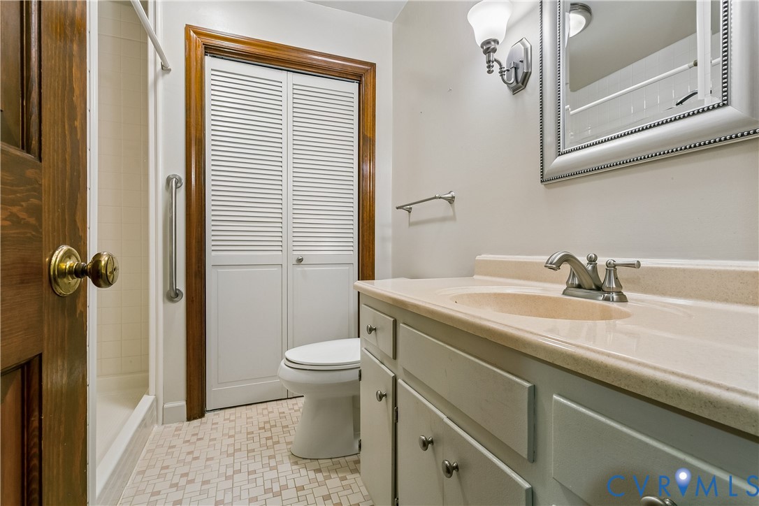 504 Meadowfield Road Yorktown, VA 23692 - Photo 21 of 45 a bathroom with a sink a toilet and shower