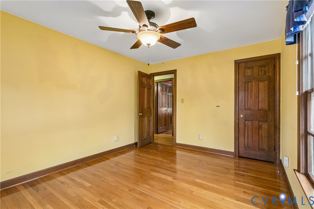 504 Meadowfield Road Yorktown, VA 23692 - Photo 26 of 45 a view of an empty room with wooden floor