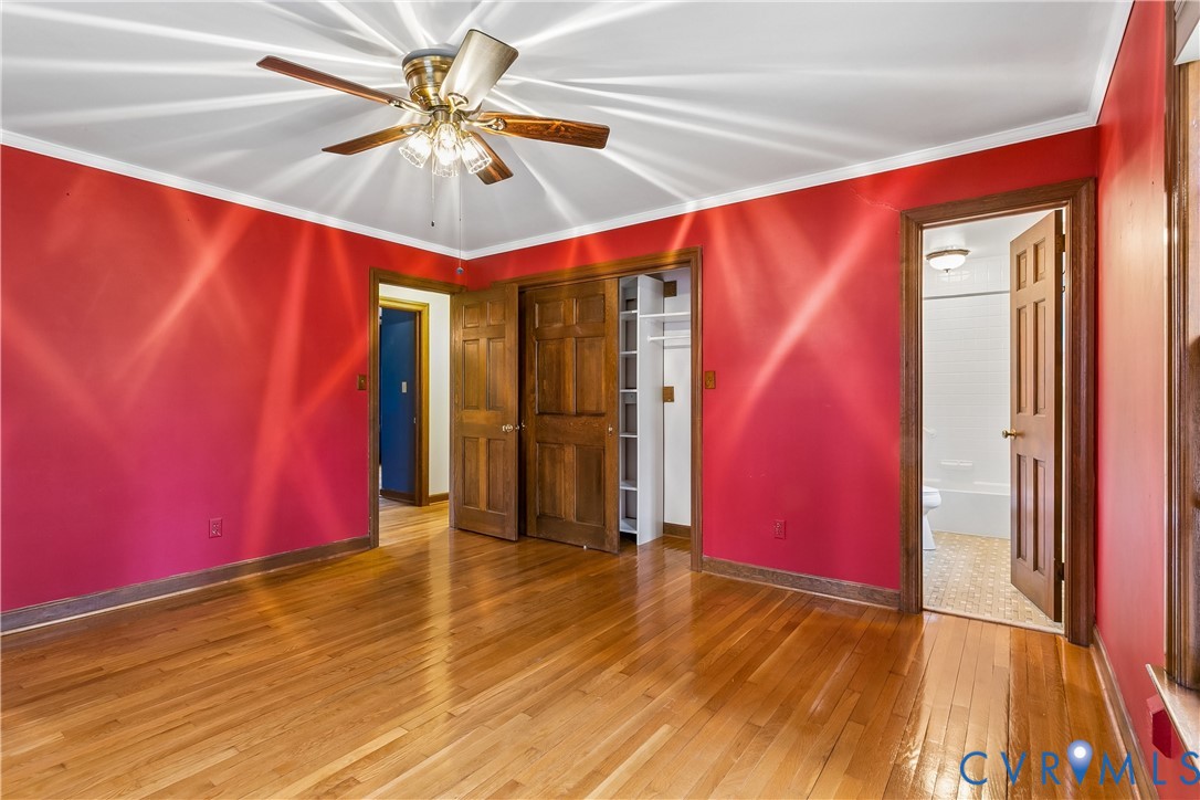 504 Meadowfield Road Yorktown, VA 23692 - Photo 28 of 45 a view of a room with wooden floor and a ceiling fan