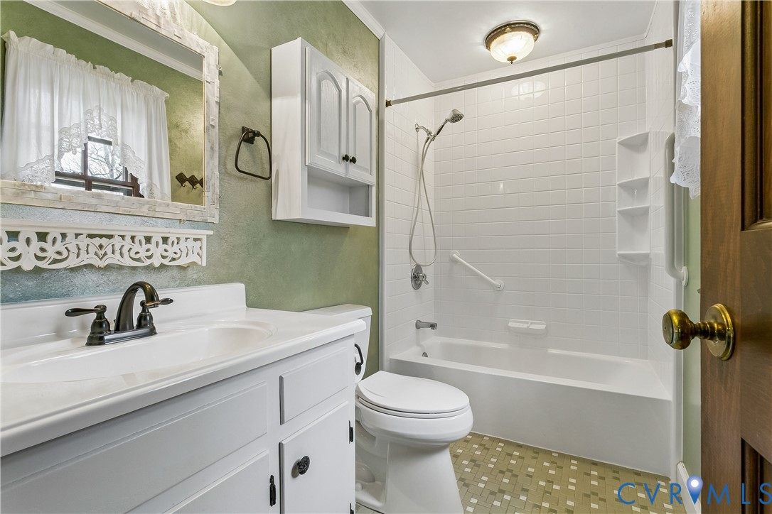504 Meadowfield Road Yorktown, VA 23692 - Photo 29 of 45 a bathroom with a sink a toilet and shower