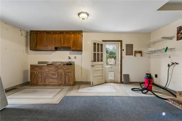 a view of a house with a yard table and chairs