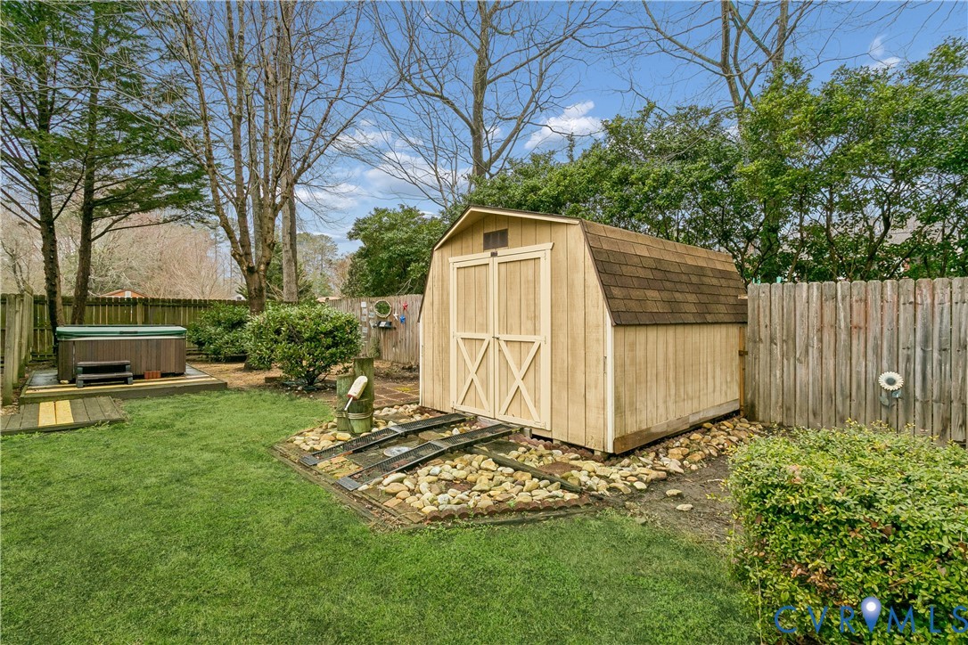 504 Meadowfield Road Yorktown, VA 23692 - Photo 40 of 45 a view of backyard with a barn and a large tree
