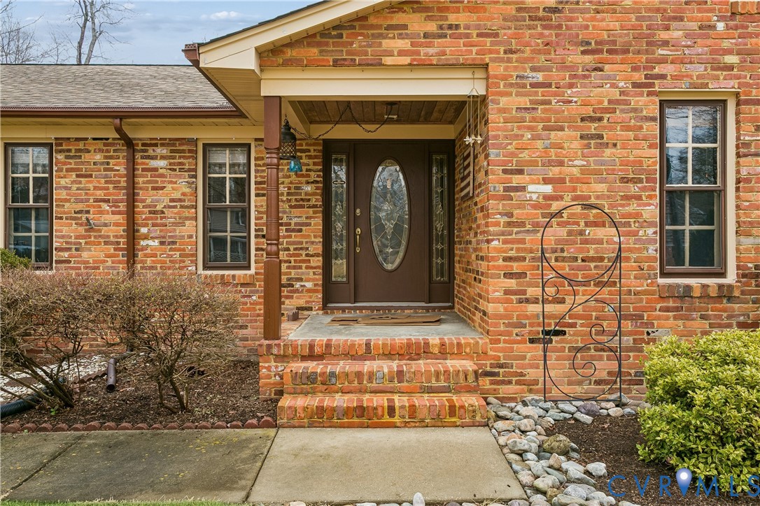 504 Meadowfield Road Yorktown, VA 23692 - Photo 5 of 45 a front view of a stone house