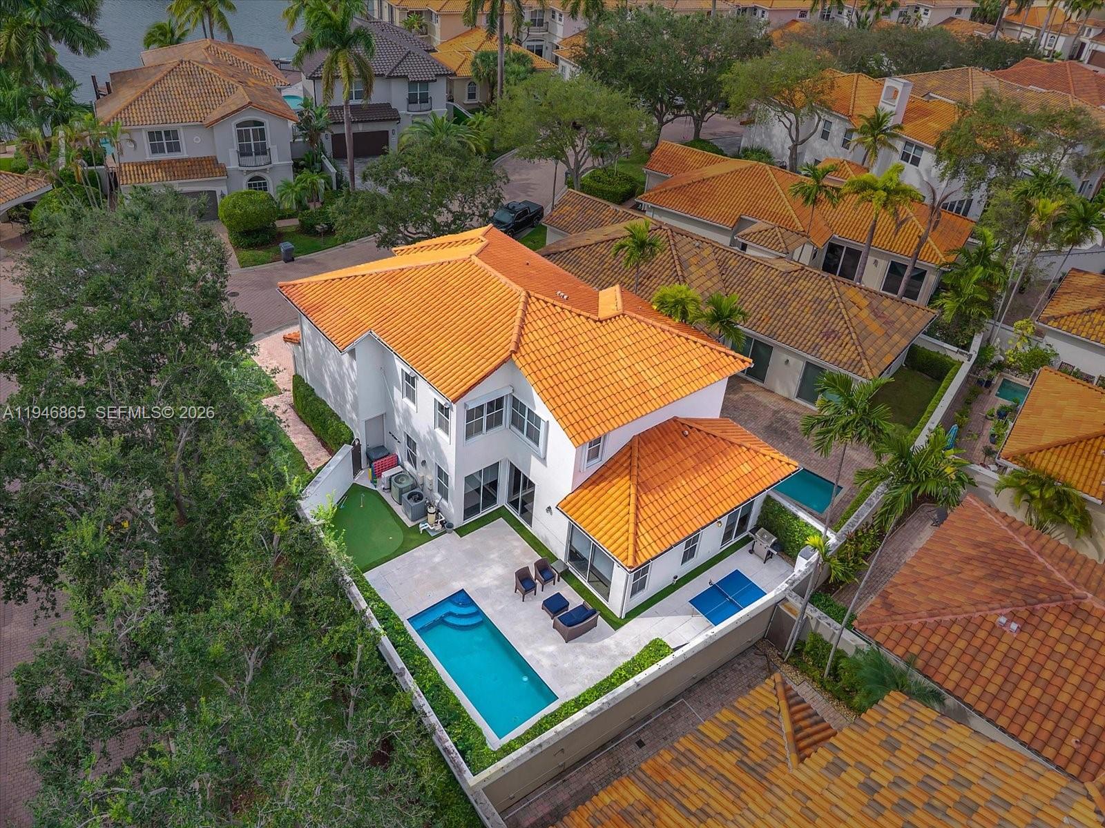 an aerial view of residential house with outdoor space and balcony