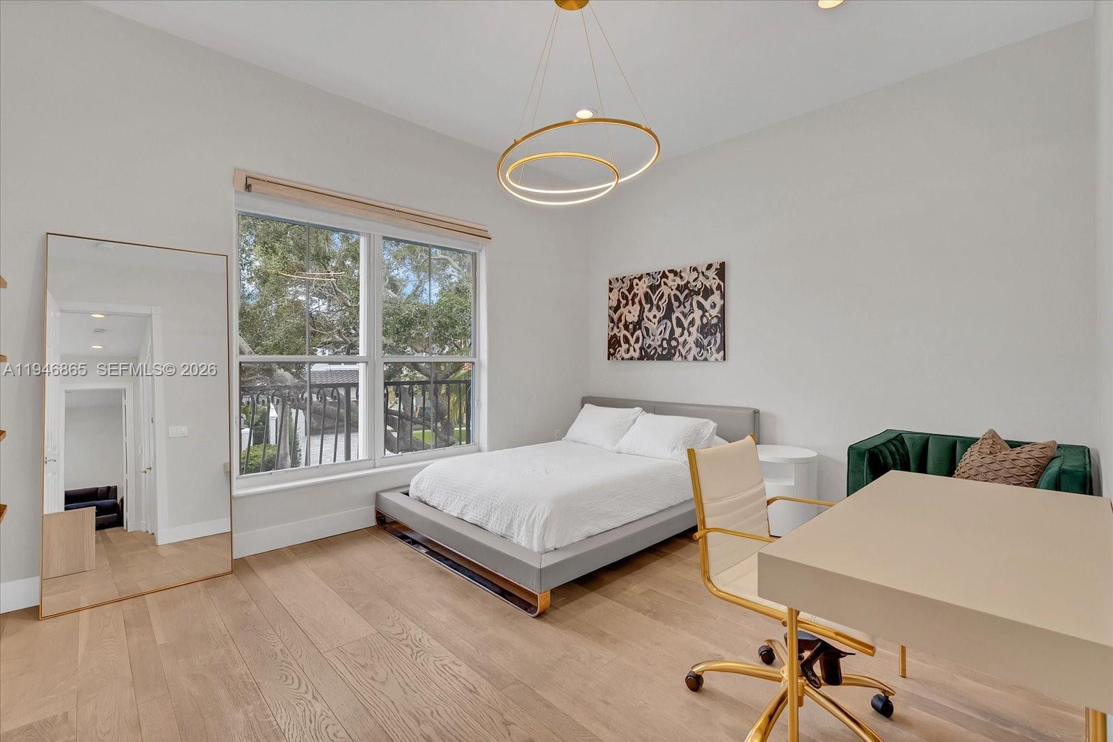 1469 Shoreline Way Hollywood, FL 33019 - Photo 18 of 46 a spacious bedroom with a bed and a large window