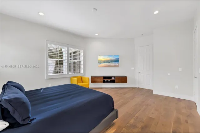 a bedroom with a bed and a couch