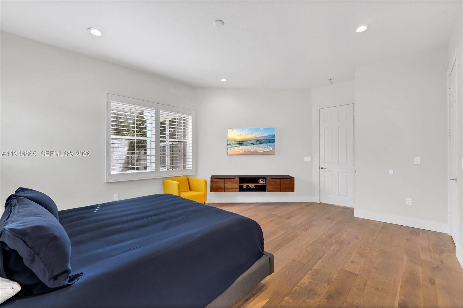 1469 Shoreline Way Hollywood, FL 33019 - Photo 23 of 46 a bedroom with a bed and a couch